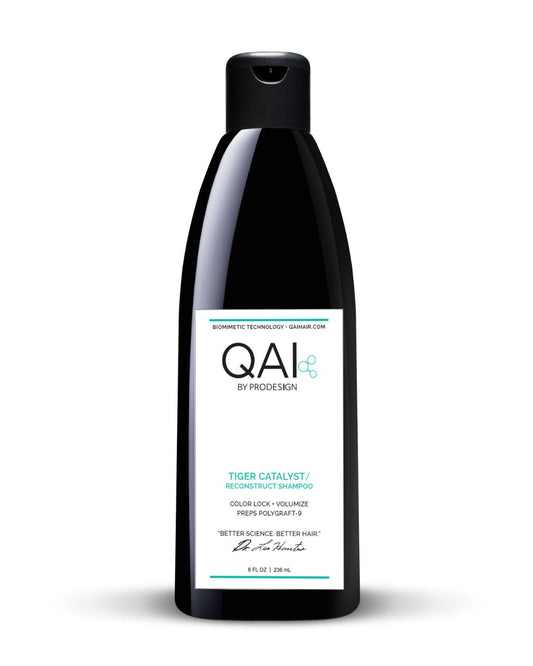 Black shampoo bottle with QAI by ProDesign label on a white background