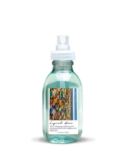 Clear bottle with a label featuring colorful images on a white background